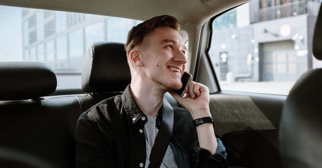 Man in Black Jacket Sitting Inside Car