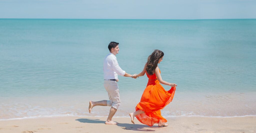 Man and Woman Walks Beside Green Sea