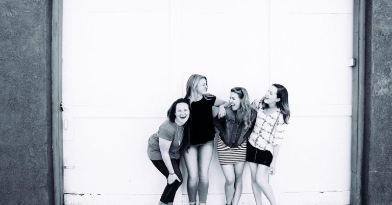 Grayscale Photography of Four Women Wearing Clothes