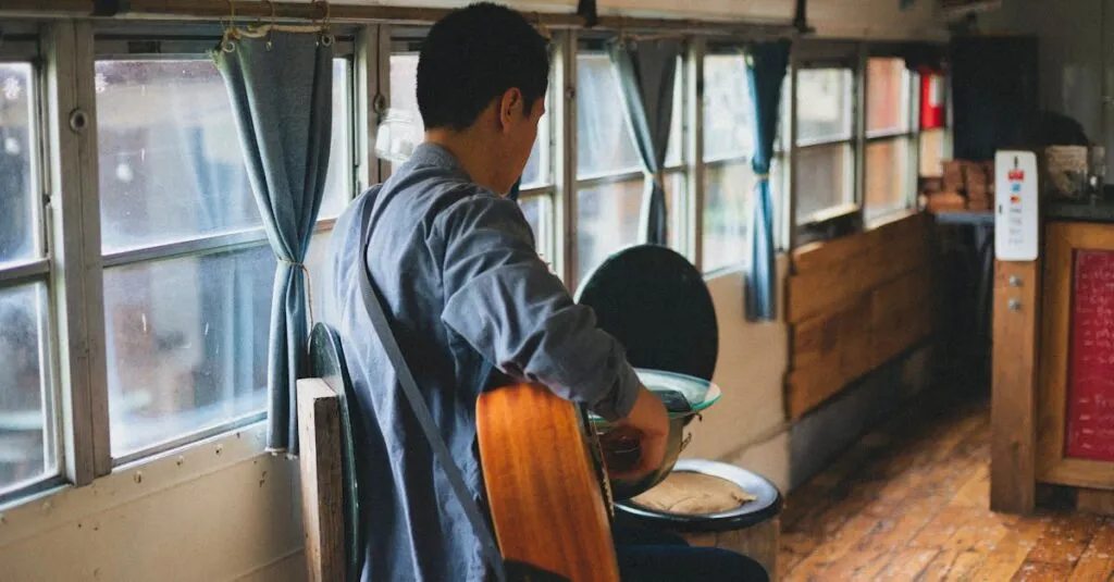 Best Bus Service from Washington DC to New York City that is Comfy and Cheap at the Same Time! 2 October 17, 2026 A man plays an acoustic guitar inside a converted bus with rustic interior design.