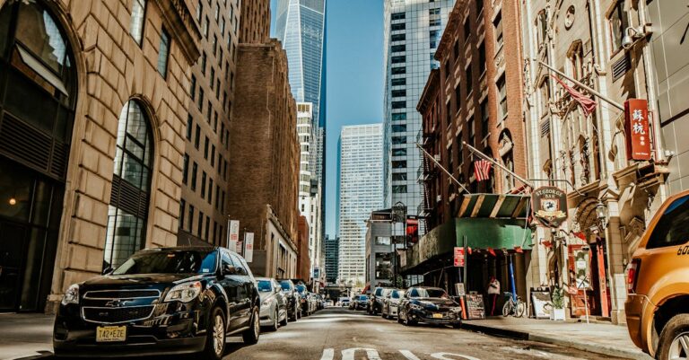 Dynamic street view of New York City with skyscrapers and urban life.