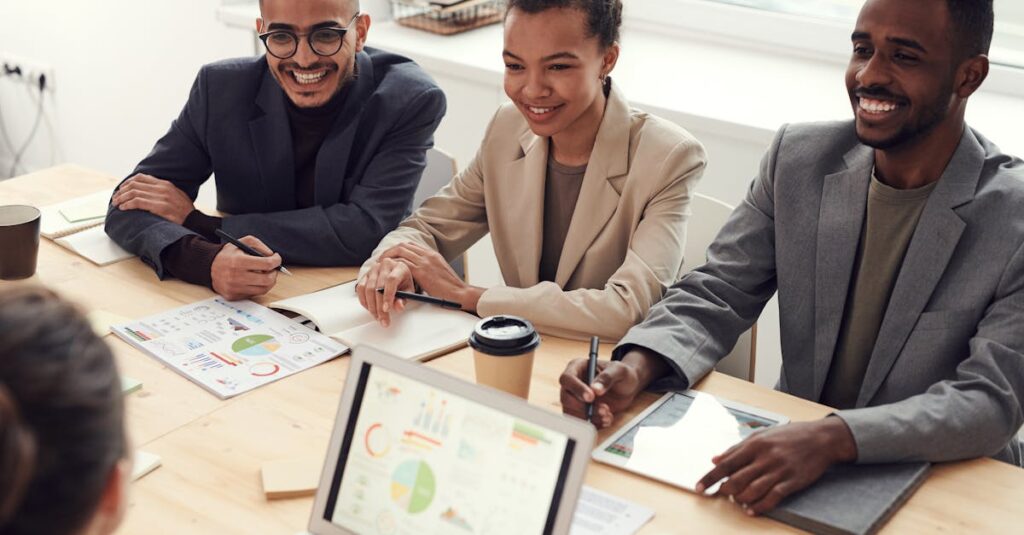 A diverse team of professionals having a meeting in a modern office setting, discussing business strategies.