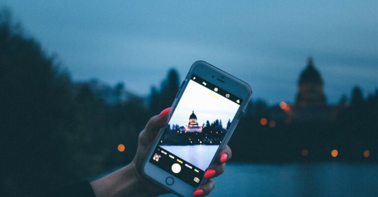 A smartphone captures the Capitol Building at twilight, highlighting iconic architecture and technology.