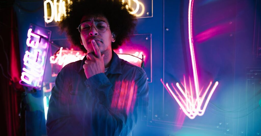 Colorful image of a stylish young adult surrounded by vibrant neon signs.