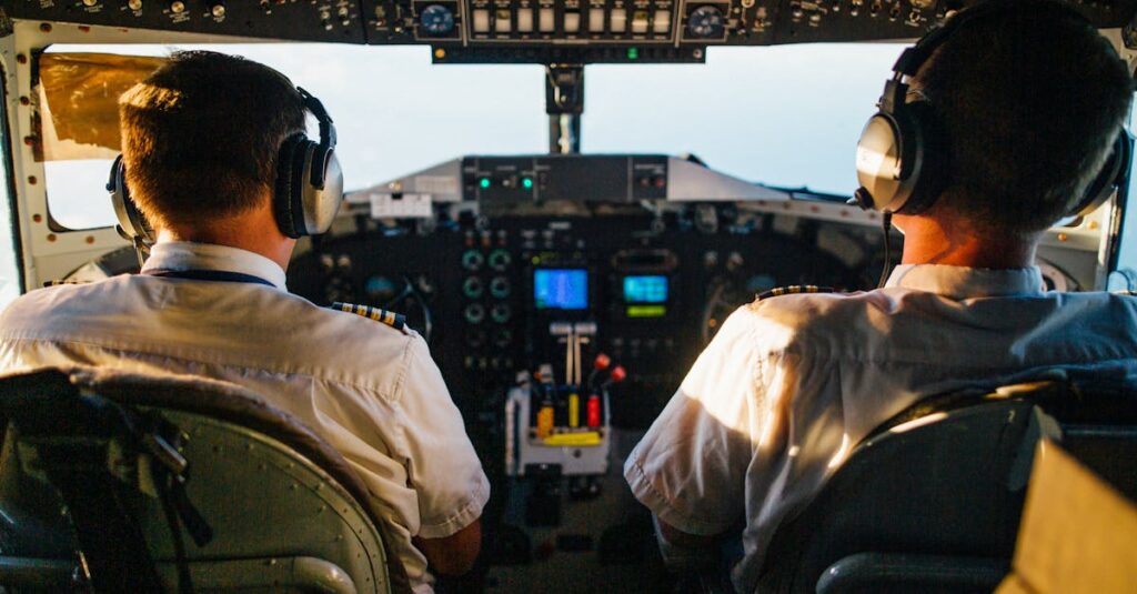 Two pilots in cockpit navigating airplane at high altitude, daylight