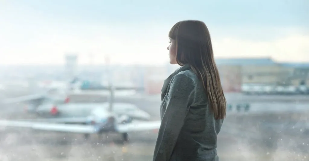 Travelers queuing for JFK to Manhattan taxi at bustling airport terminal in 2025