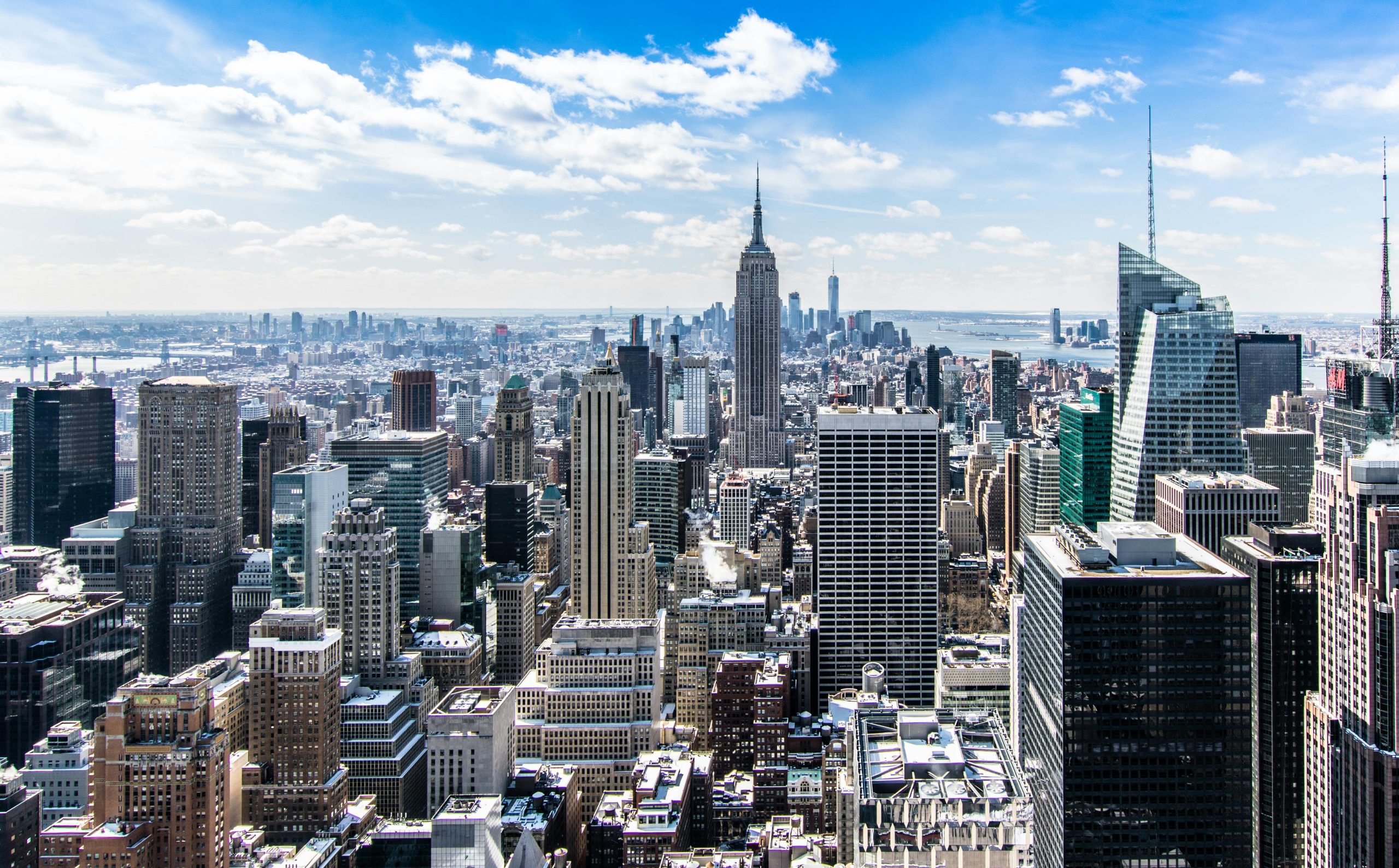 Blogs | Articles | News | Tips & Tricks | Video | FAQ | Infomation 12 September 20, 2026 A stunning aerial view of New York City's skyline featuring the iconic Empire State Building under a bright blue sky.