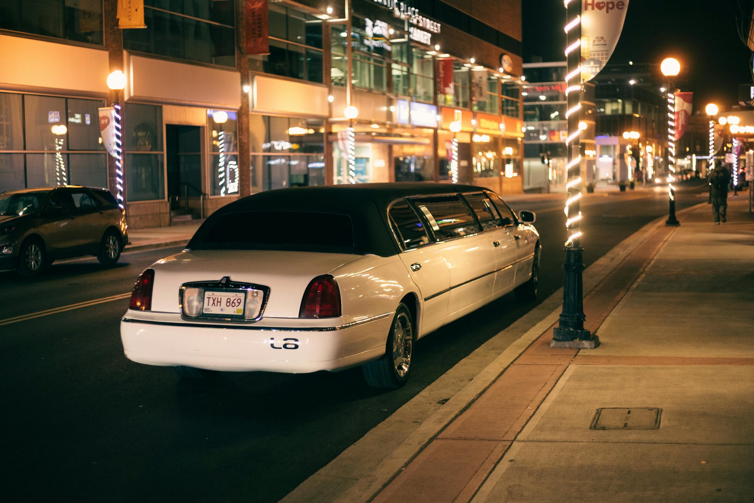 Blogs | Articles | News | Tips & Tricks | Video | FAQ | Infomation 10 September 22, 2026 White limo with tinted glasses and license plate on roadway against buildings illuminated by street lights in evening city