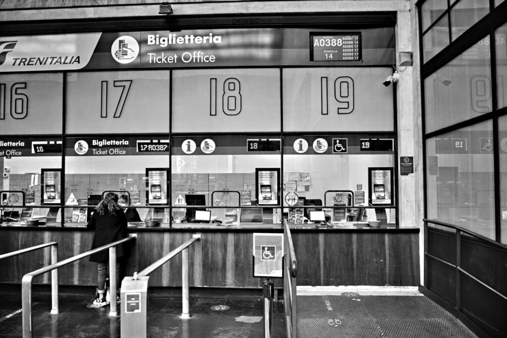 Airport Luxury Ground Transportation Services Close to Me in 2026: What I’ve Learned After Way Too Many Late-Night Airport Runs 4 October 9, 2026 Monochrome image of a train station ticket office with numbered counters, showcasing travel services.
