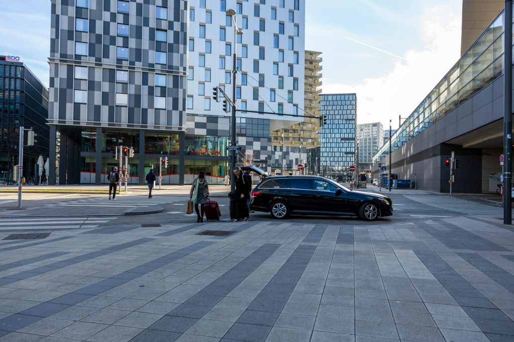 how much is a car service to jfk from brooklyn  black SUV at JFK airport arrivals terminal
