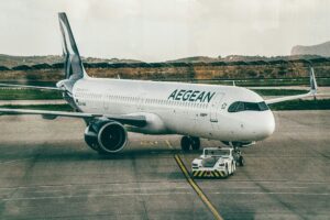 Aegean Airlines Aircraft Being Towed At An Airport, Ready For Takeoff.