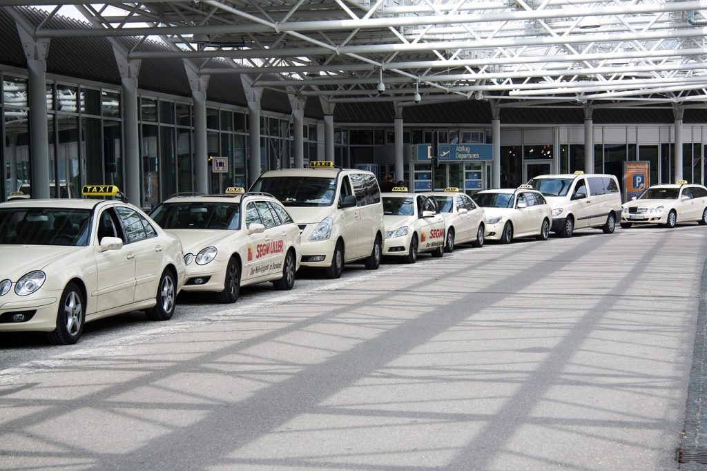 taxi fare from JFK yellow cab waiting at JFK airport arrivals zone