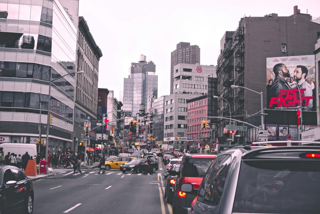 NYC 10025 Car Service: 6 Honest Facts for First-Time Visitors 2026 5 September 24, 2026 Lively city street in New York with bustling traffic and urban buildings during the day.