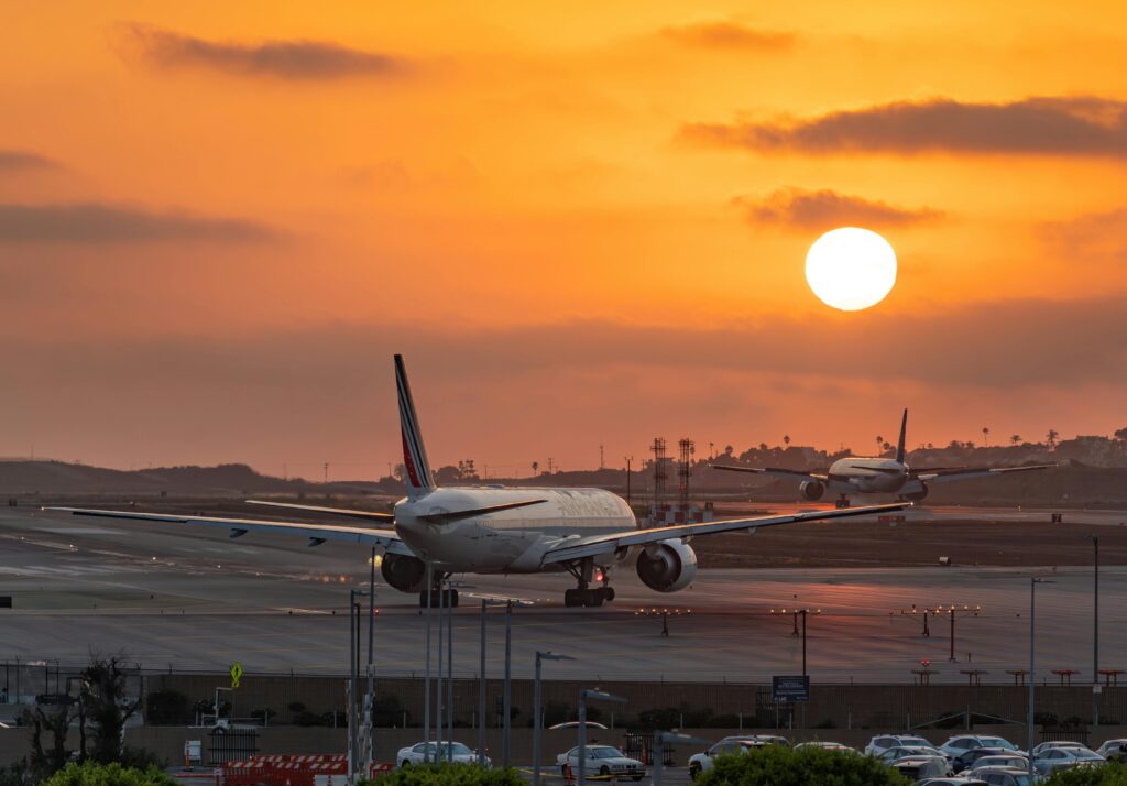 lga jfk : 6 Brutally Honest Realities Corporate Bookers Face in 2026 6 September 19, 2026 A stunning view of airplanes taxiing at Los Angeles Airport with a vibrant sunset in the background.