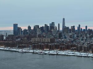 A Stunning Aerial Shot Of New York City Skyline Covered In Snow During The Day.