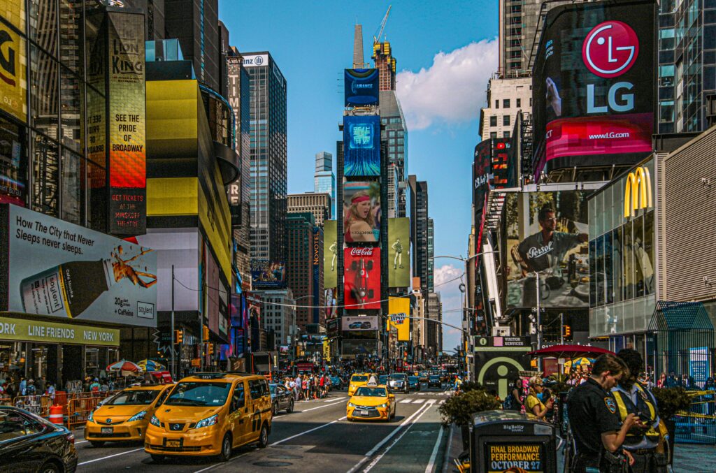 Party Bus Rental in NYC: 7 Honest Facts for Bachelorette 2026 3 September 24, 2026 Dynamic street view of Times Square, NYC filled with billboards, taxis, and people.