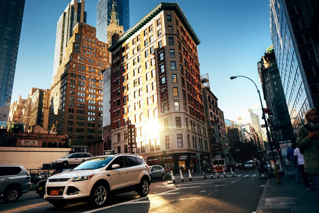 Best Car Service NYC to JFK: 7 Honest Facts for 2026 5 September 18, 2026 A bustling New York City street with towering buildings at golden hour, capturing urban life.