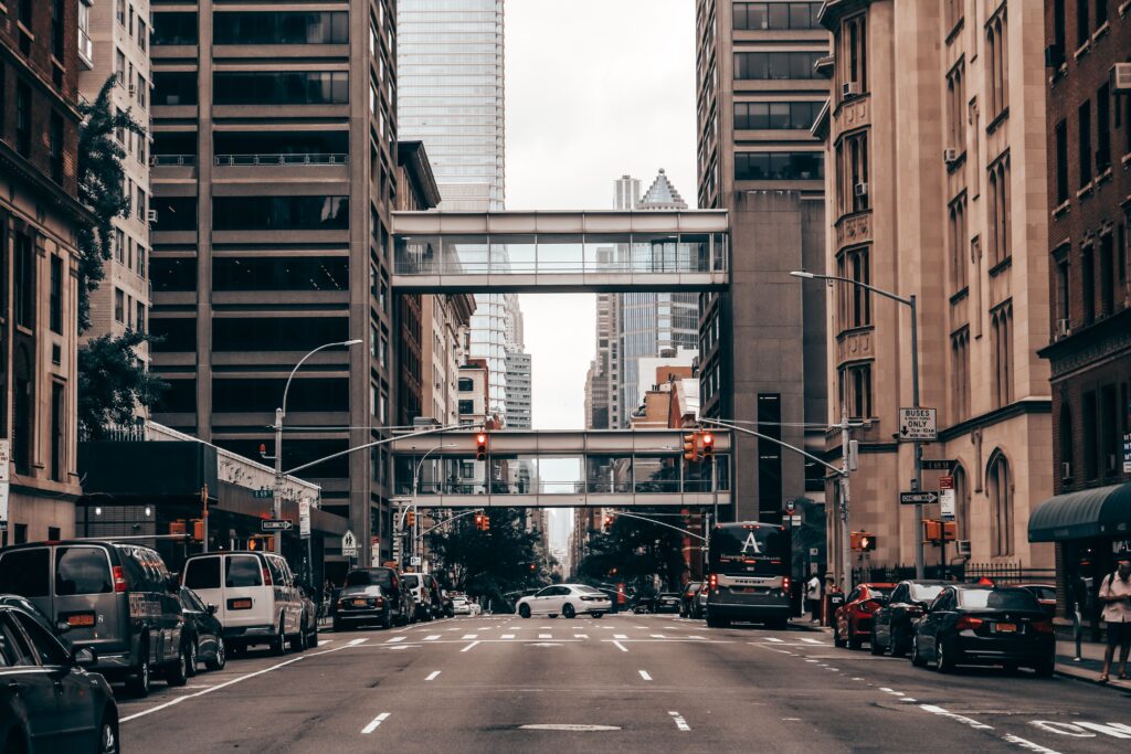 Best Transportation from JFK to Manhattan: 7 Honest Facts for Business Travelers in 2026 4 September 20, 2026 Dynamic view of a busy New York City street with traffic and towering skyscrapers.