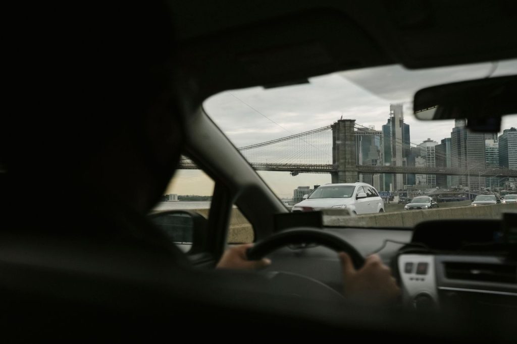 laguardia shuttle black car sedan at LaGuardia airport terminal pickup zone