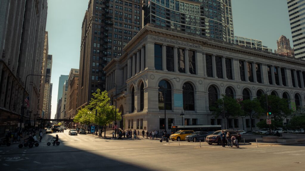 Bustling city intersection showing iconic architecture in Chicago during daytime.