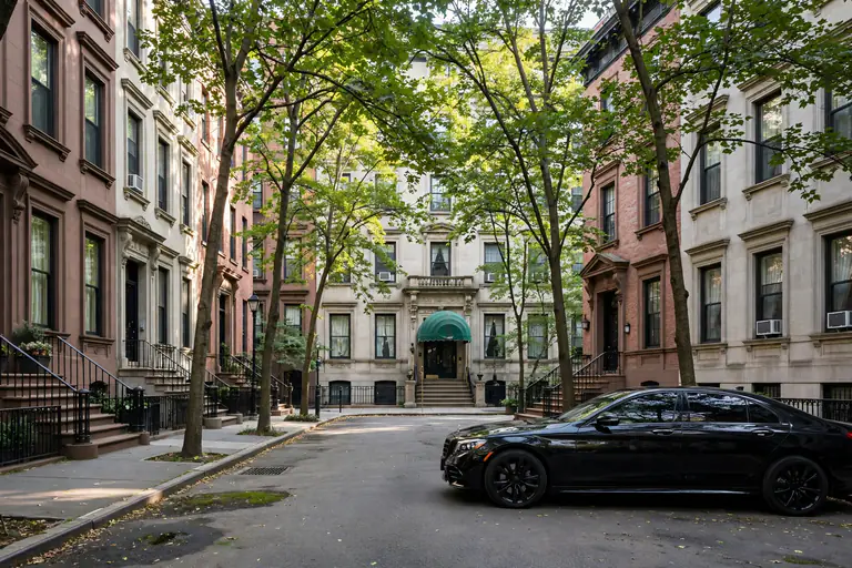 car rental ues: black sedan parked at the curb on a tree-lined Upper East Side brownstone street in the morning